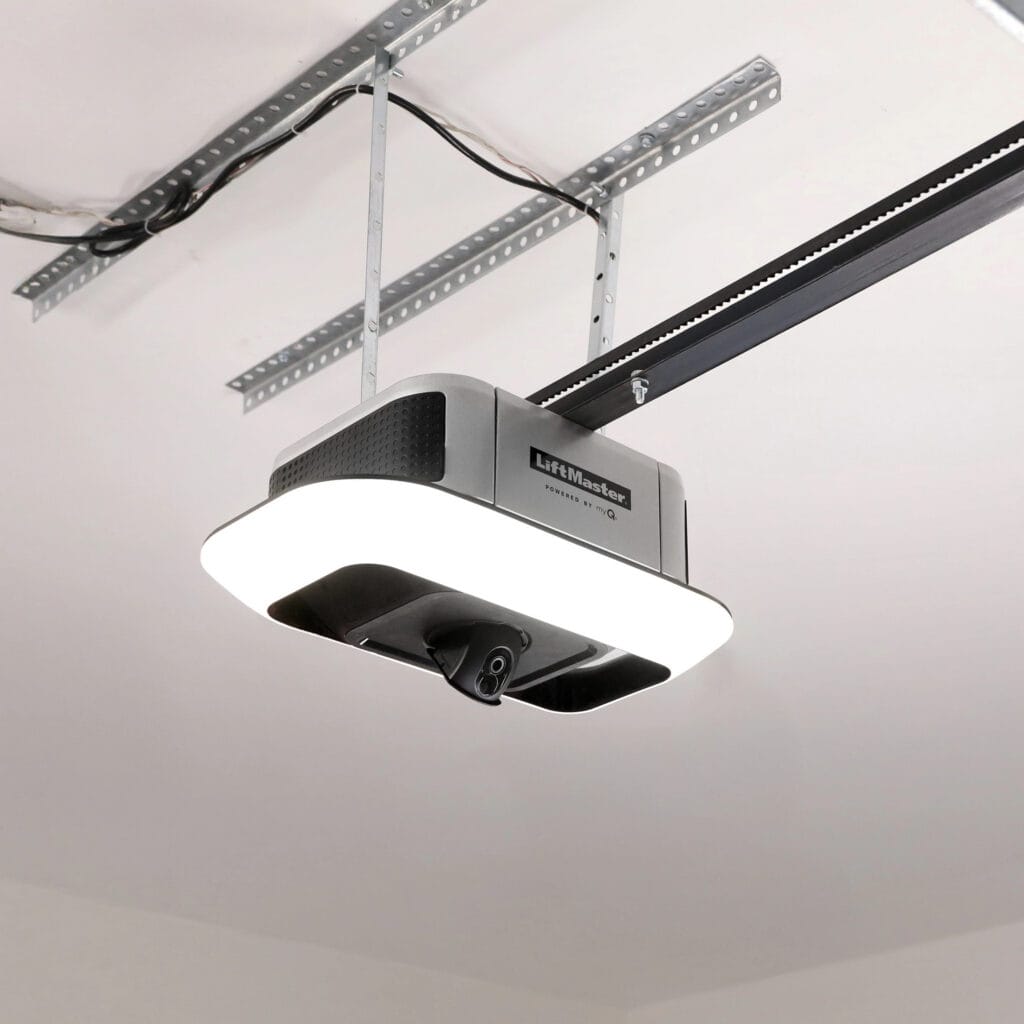 Ceiling-mounted LiftMaster garage door opener with LED light and metal support brackets, installed on a white ceiling.